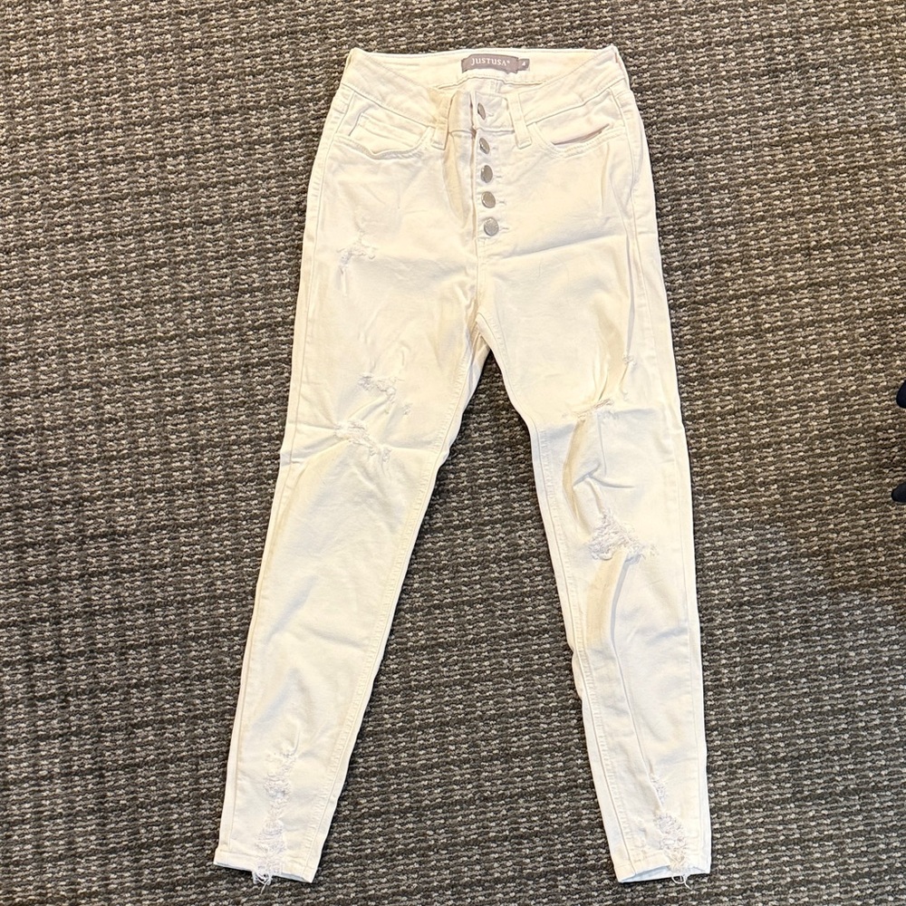 Women's distressed white Jeans. 5 buttons. size 4